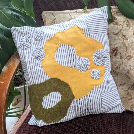 Recycled shirt applique cushion cover
